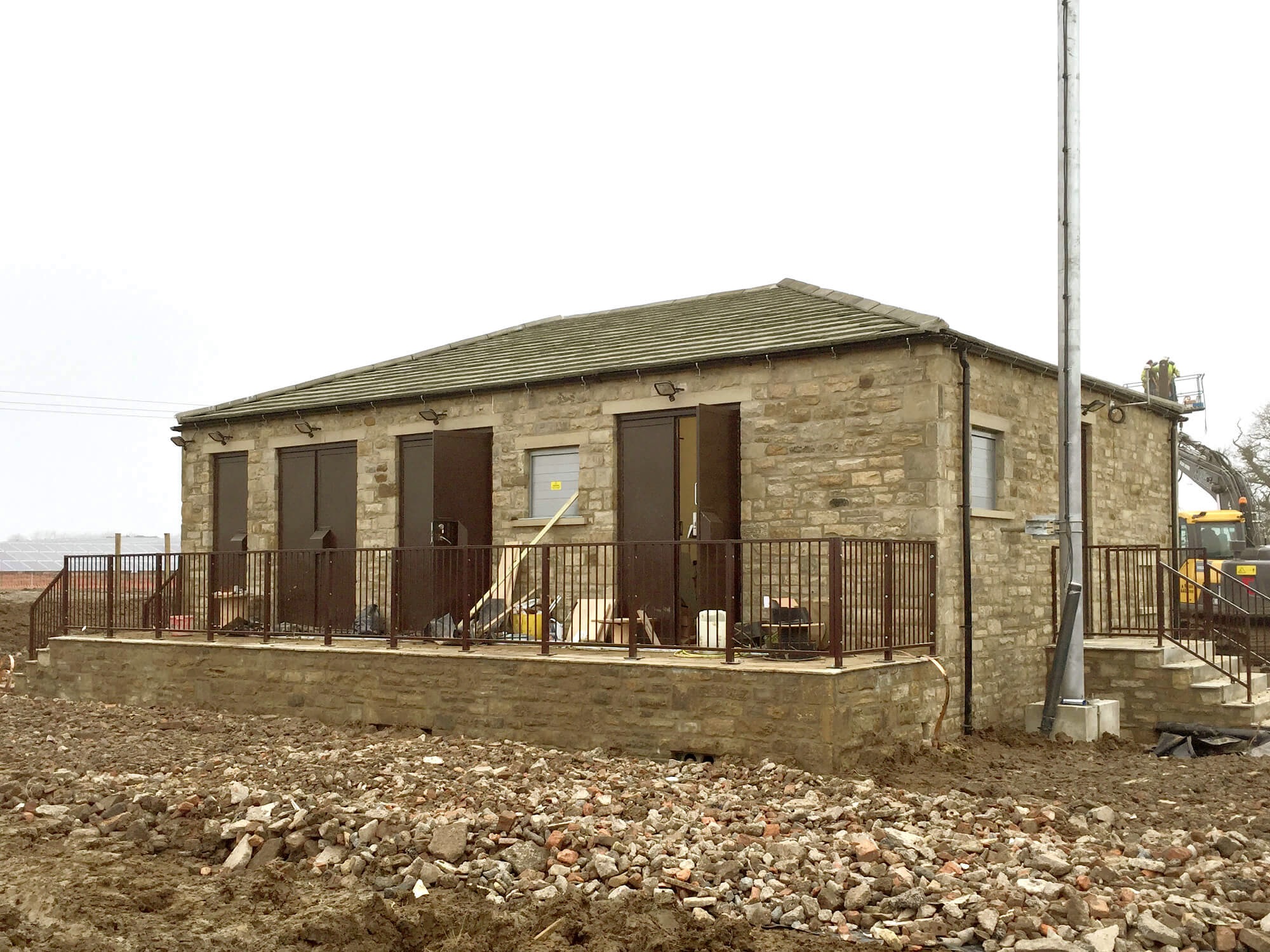 Substation completed with landscaping underway.